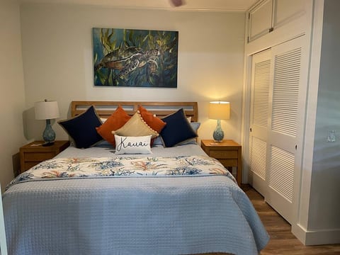 California King Bed in bedroom
Dresser, Ceiling Fan and TV