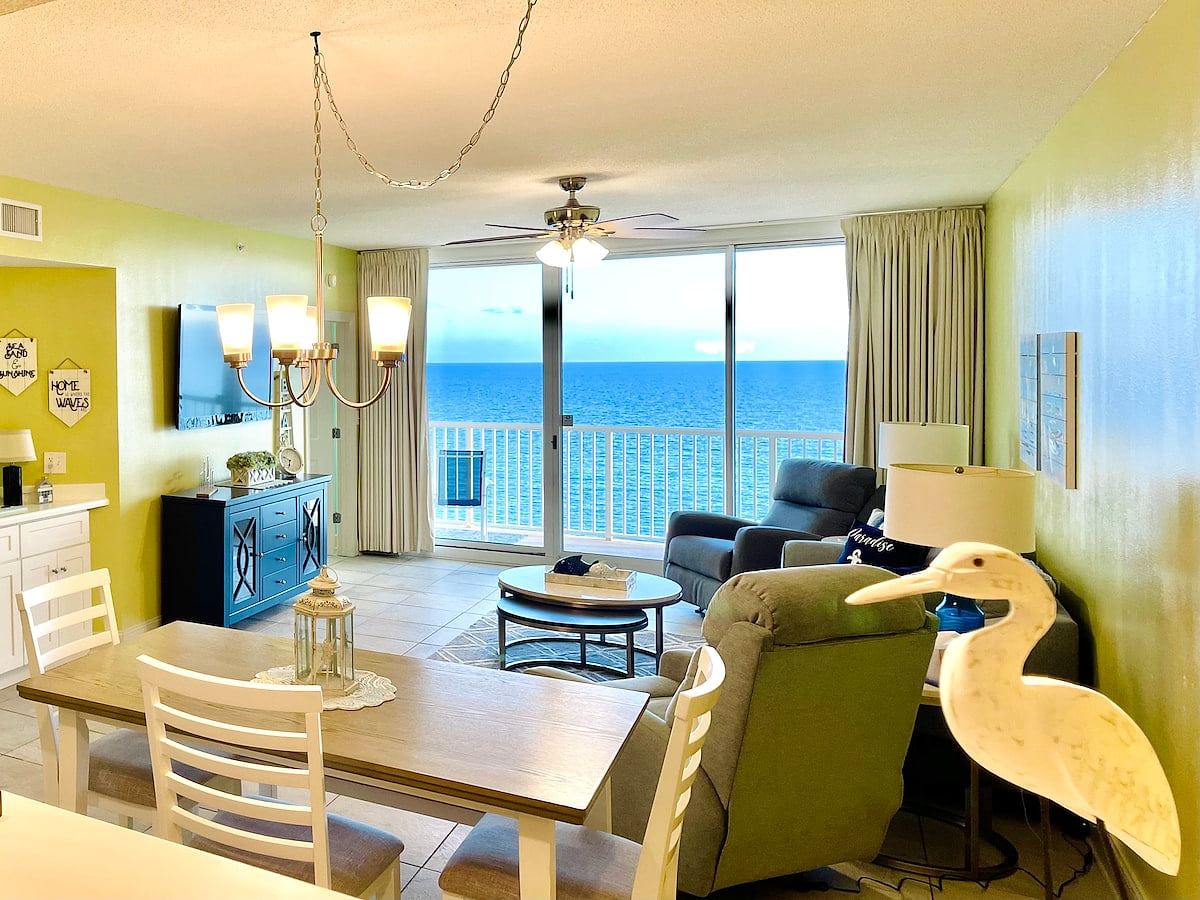 Spacious beachfront living area with access to the large balcony.  Spacious Beachfront Condo with Beachfront Master!