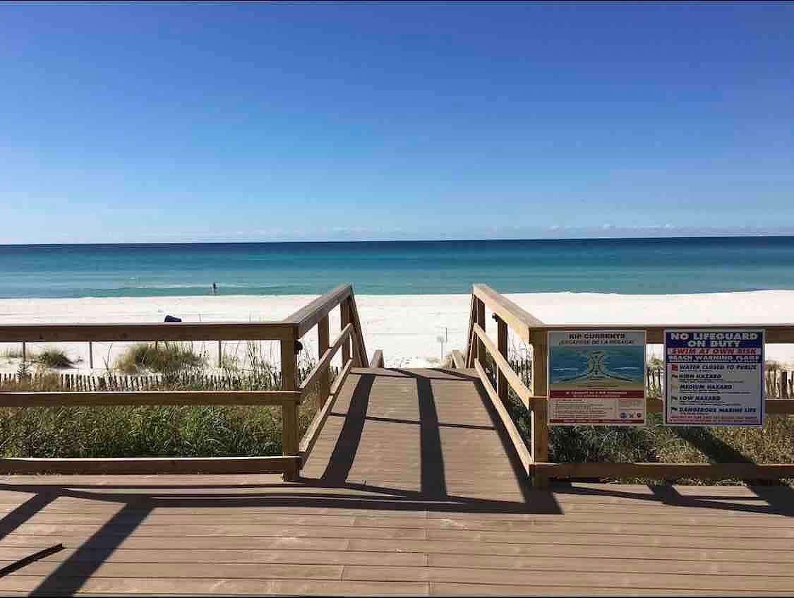 Direct beach access with stairs and a ramp. 