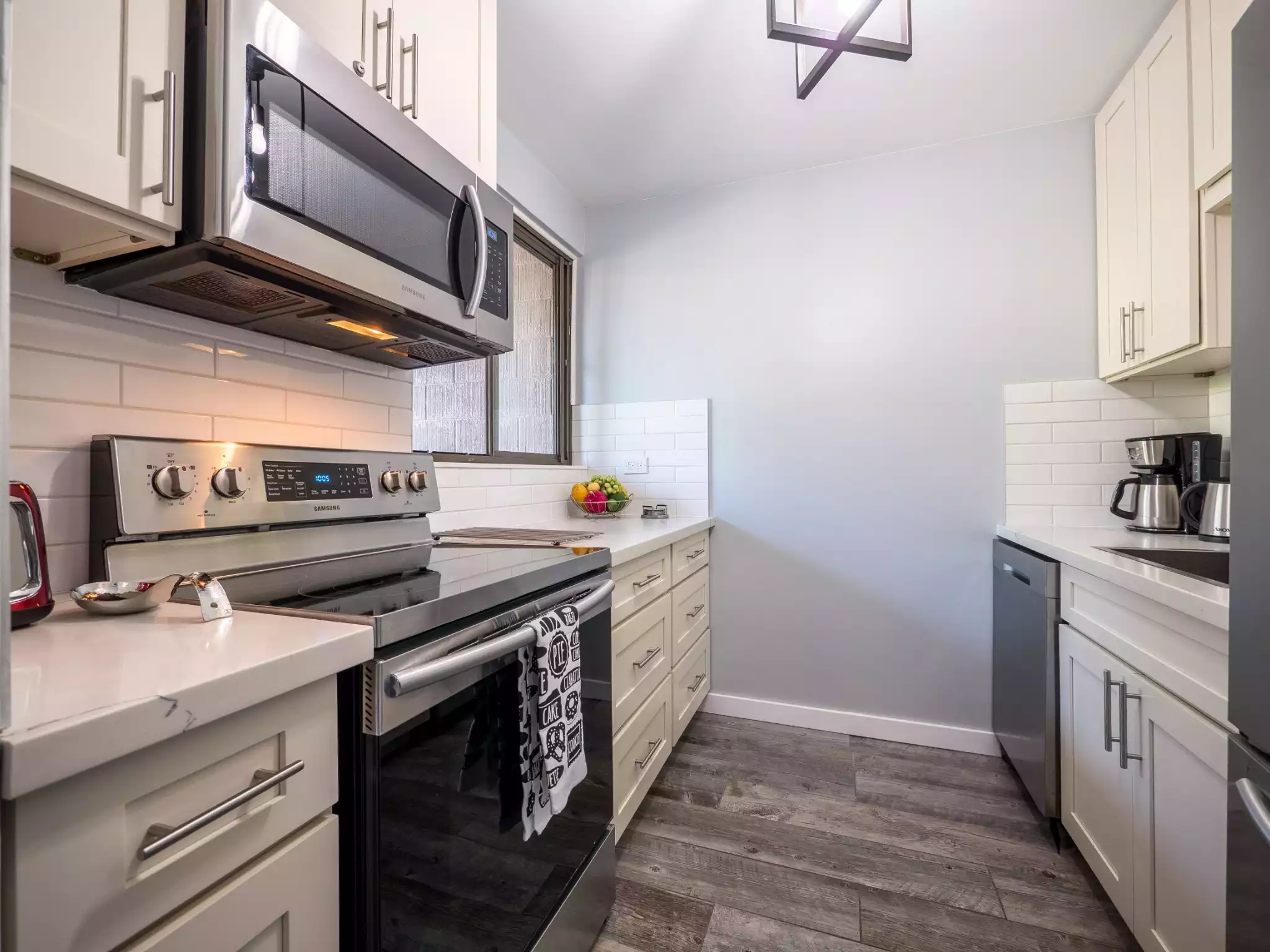 Fully stocked kitchen offers you the opportunity to cook your own meals. - Maui Makai Condo - Lahaina