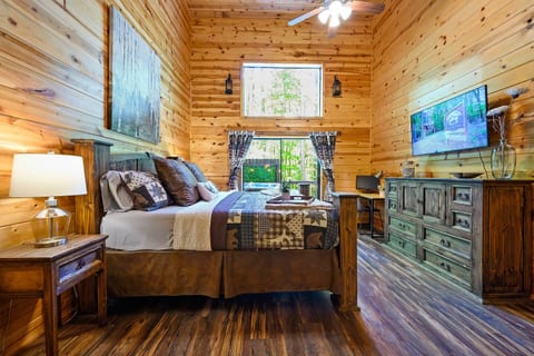 Master bedroom, view out to hot tub and back deck