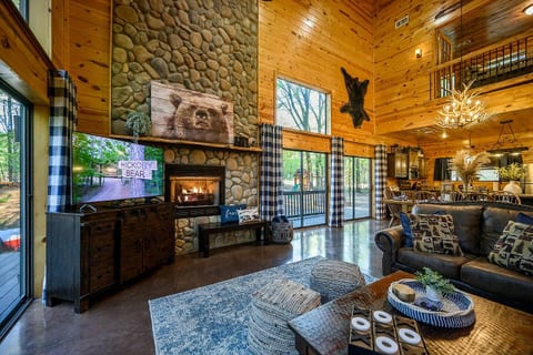 Living room with view into kitchen. Sliding doors to wrap around deck