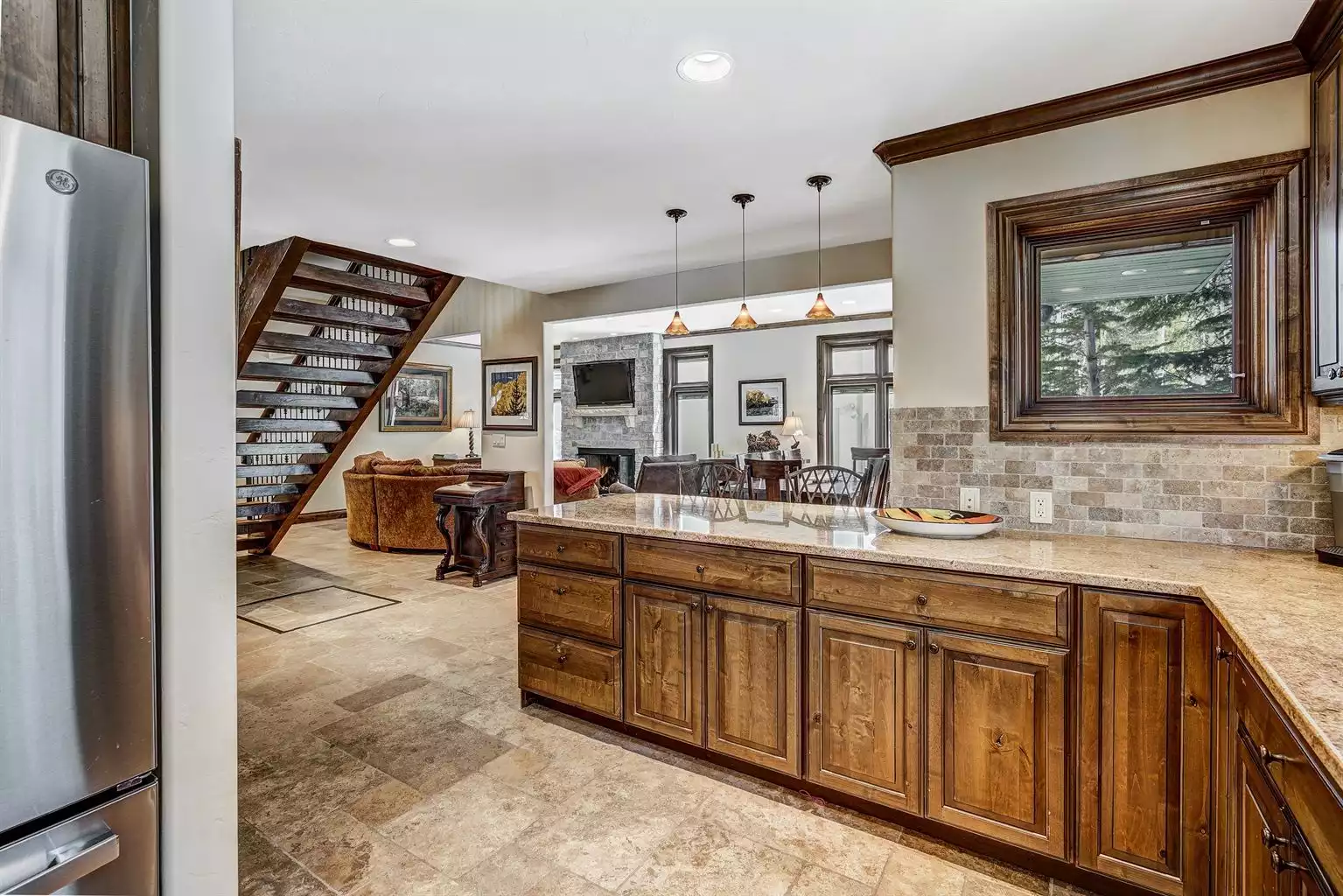 Kitchen with open floor plan to dining and living areas. - East Vail Outpost - Vail