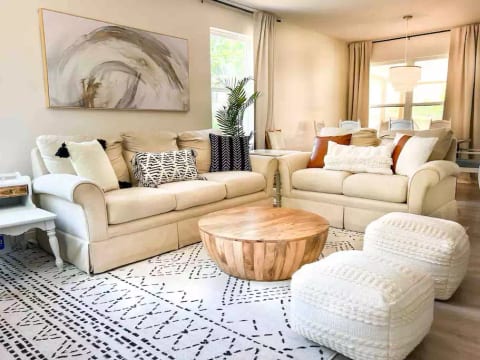 Living room with plenty of seating and open floor plan.