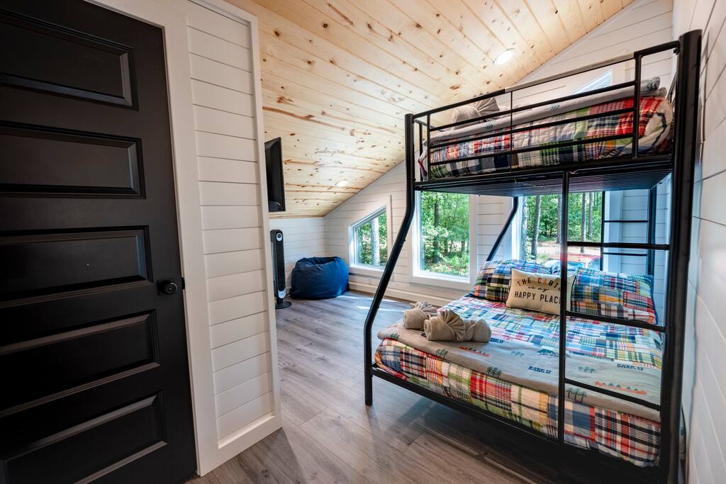 Upstairs bunk room with twin over full Nectar mattresses.