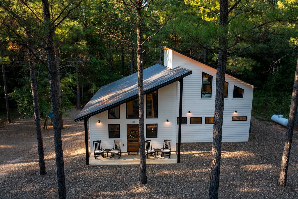 Modern design cabin nestled in the woods.