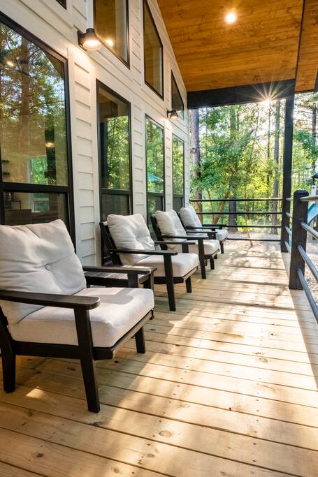There's no shortage of outdoor seating at Hammock Hideaway! Enjoy lounging here & enjoying the beautiful wooded view & watch the kids play on the outdoor playset. 