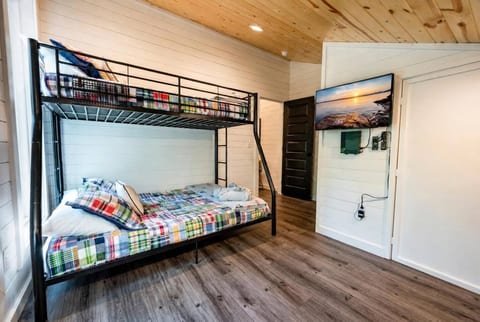 Upstairs bunk room with twin over full bunk beds. 32" smart TV with DVD player.