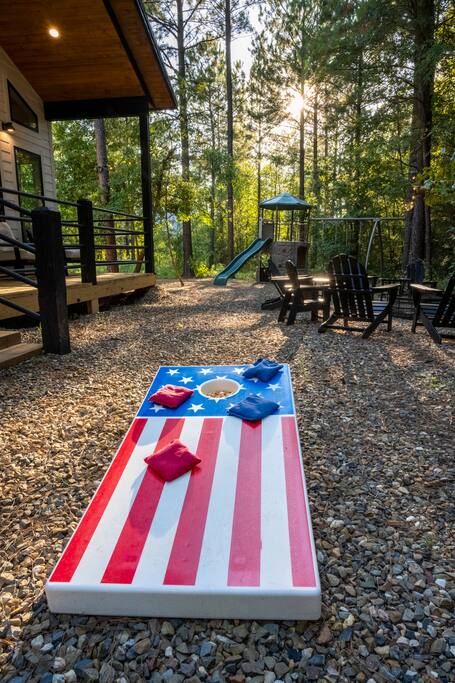 Play a competitive game of cornhole while surrounded by nature.