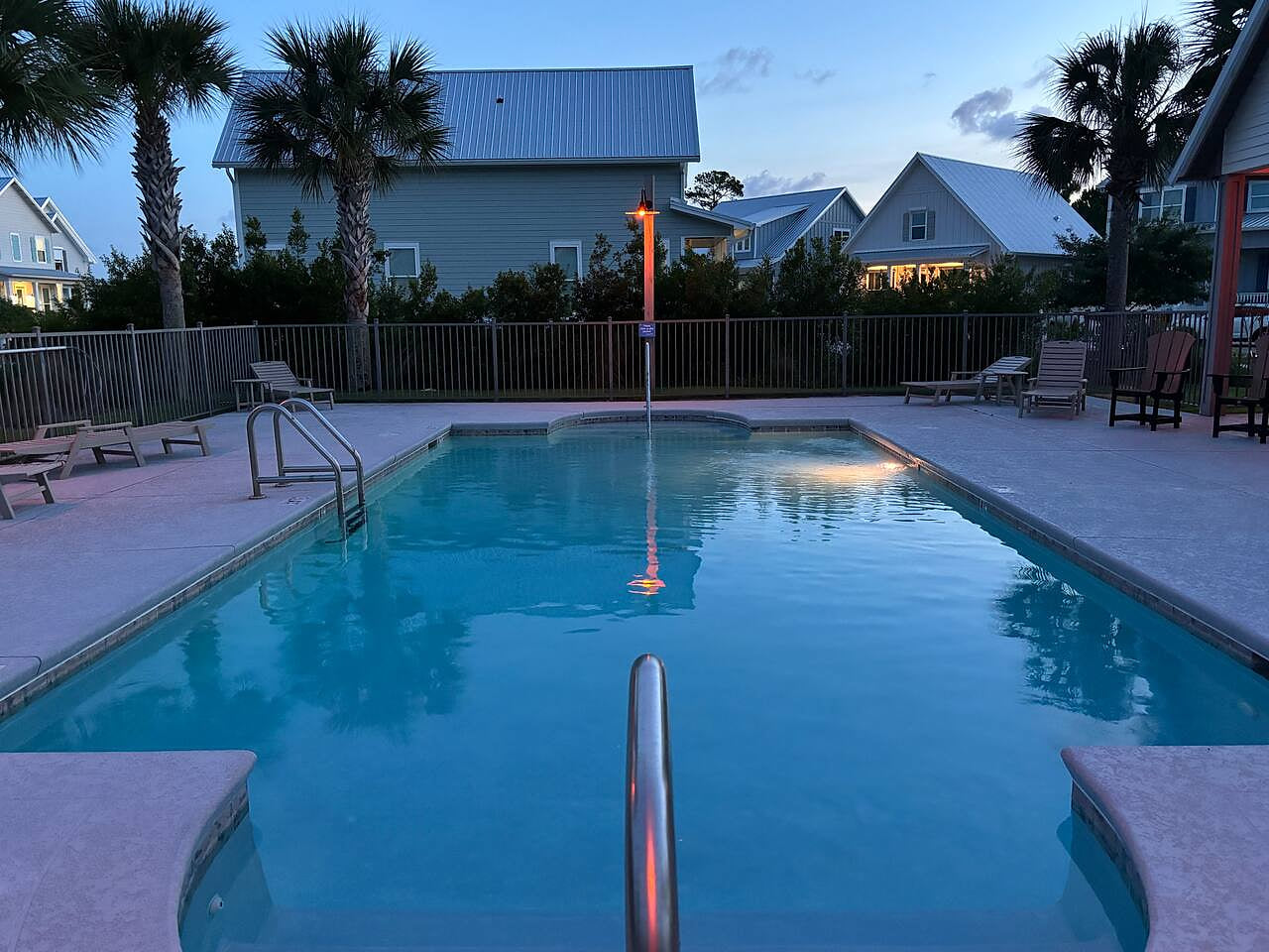 Dive into calm evenings and cool waters at the public pool near your beach town getaway.