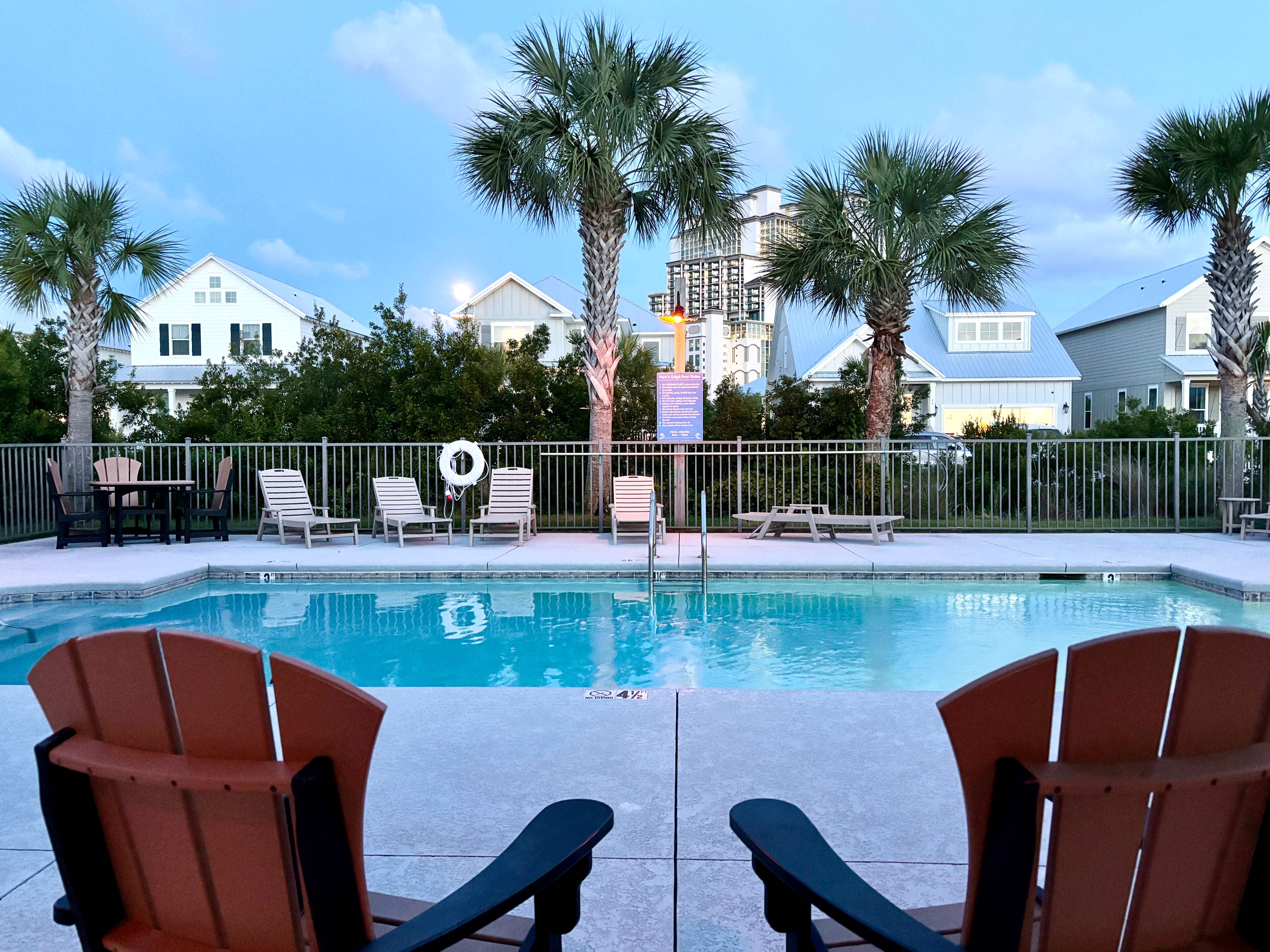 Catch sunset vibes by the pool, where palm trees sway and coastal dreams come alive.