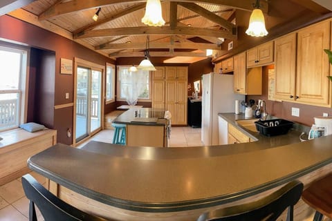 Spacious kitchen with updated stove and convection oven, fridge, microware and dishwasher.