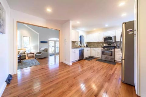 Large cape code home with open floor plan and gourmet kitchen with gas convection oven for the discerning chef