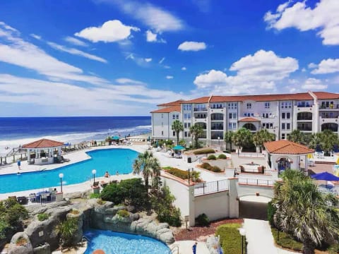 View from our balcony overlooking the pools and beach