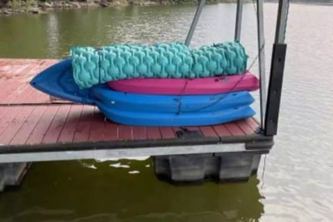 Three youth kayaks, one adult kayak and lily pad