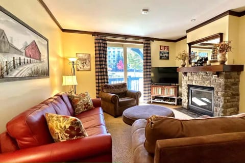The warm and inviting living room has direct access to the patio with a view of the pond and fountain.
The gas fireplace operates with the simple turn of a timer switch.