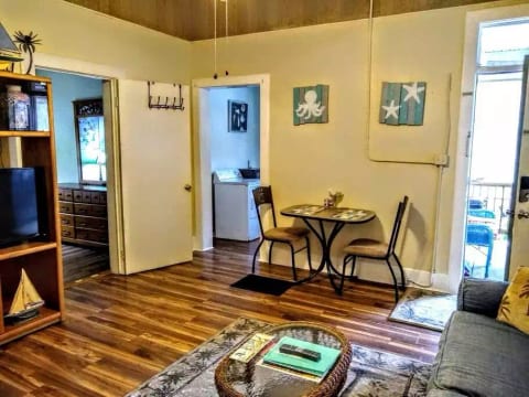 Coming in from front door, kitchen & bath thru door on right, & bedroom thru door on left.