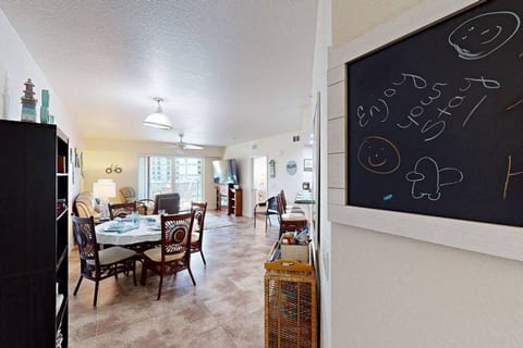 The hall way headed in to the dining room and then living room. On the book shelf you will find games and books for you to use while you are at you Vacation home.