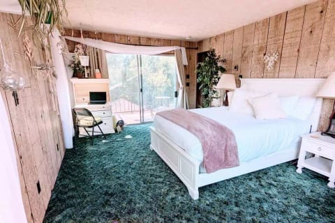 "Air" (upstairs): A secretary desk provides a functional surface for writing & working with a view out to the spacious attached balcony. Guests rave about our rock-solid WiFi: perfect for zoom calls, distance learning & work-from-home!