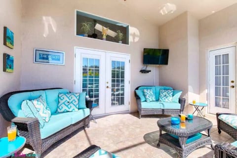 Poolside patio area with 42 inch Smart TV