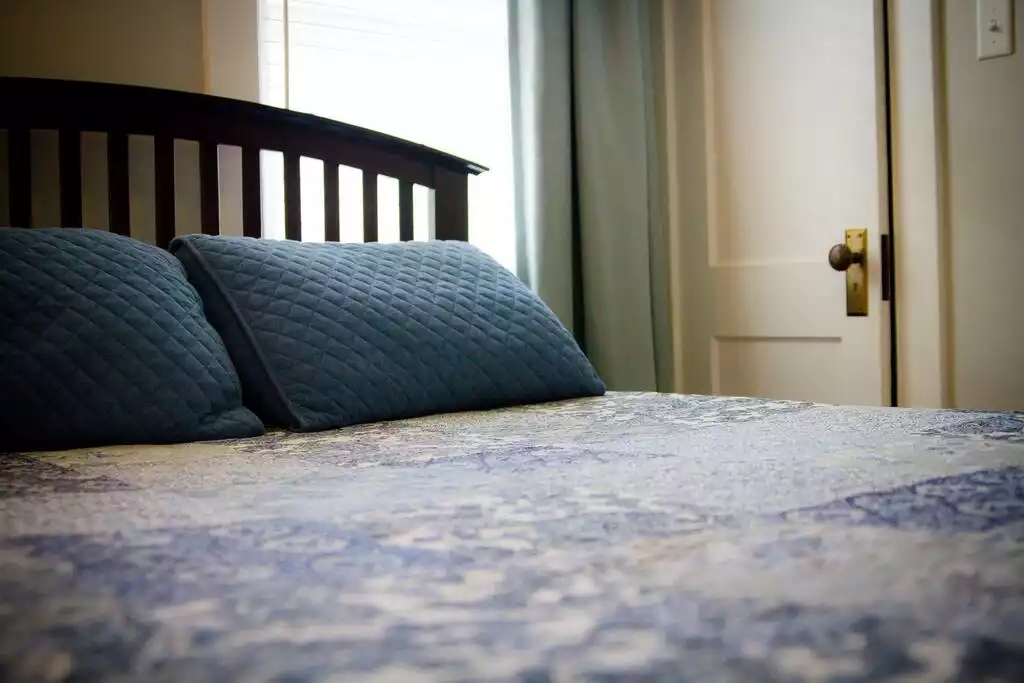 Bedroom with queen-sized bed. - The Little House Laramie - Laramie