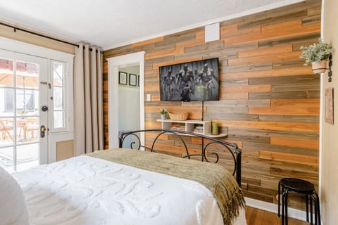 Shiplap wall. Streaming televisions, plus local channels.