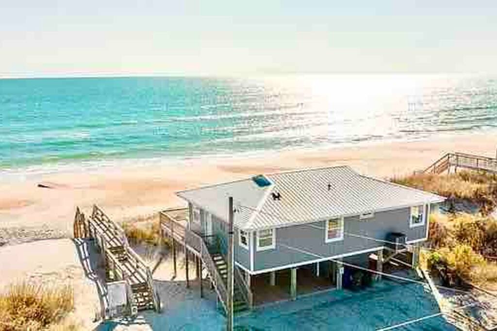 Aerial view of the property. Stairs to the entrance, latching gate to ocean front deck, and breathtaking water views as far as the eye can see. - OCEANFRONT + Stunning Views! Close to Restaurants - Surf City