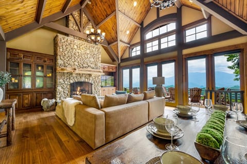 Curl up in this great room with 26 ft vaulted ceilings, stone stacked fireplace, wall of glass onto 2500+ ft elevation deck with views of Mt LeConte, 60'' Samsung TV (Netflix, Hulu, Disney+, ESPN+, YouTube TV), and ample dining space.