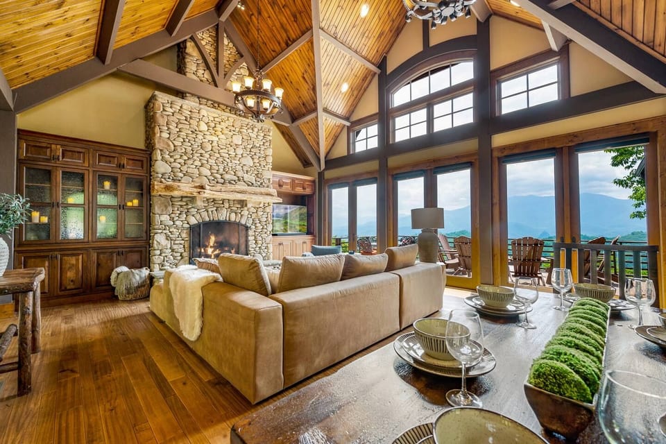 Curl up in this great room with 26 ft vaulted ceilings, stone stacked fireplace, wall of glass onto 2500+ ft elevation deck with views of Mt LeConte, 60'' Samsung TV (Netflix, Hulu, Disney+, ESPN+, YouTube TV), and ample dining space.