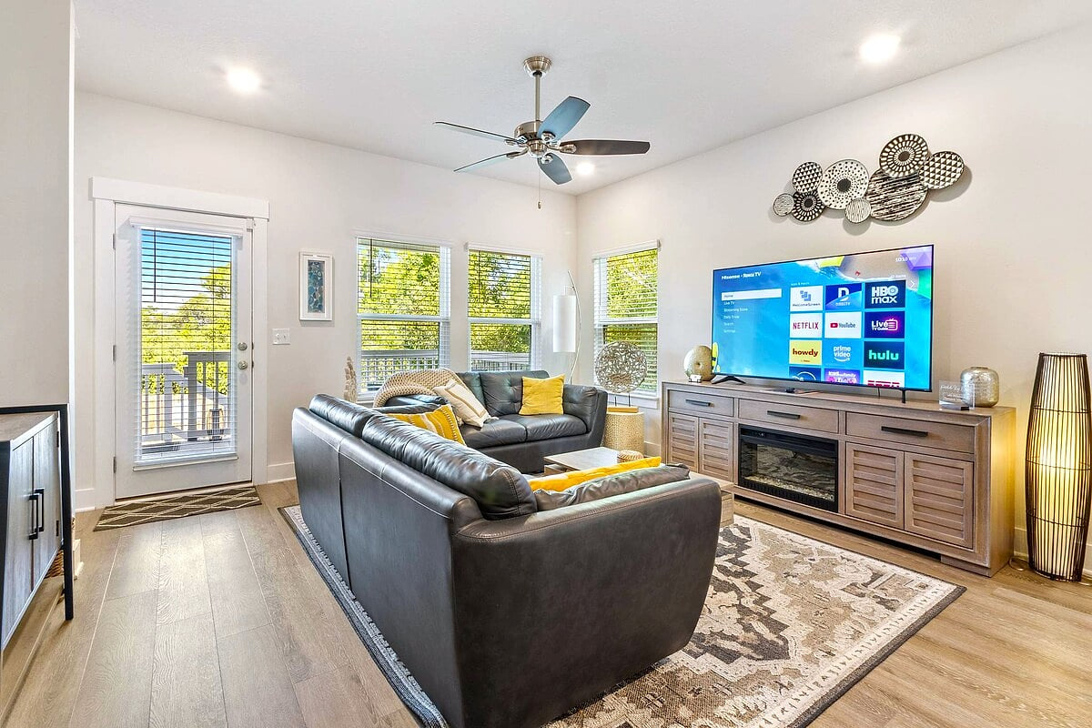 Sunny lounge with smart TV, leather sofas & balcony access