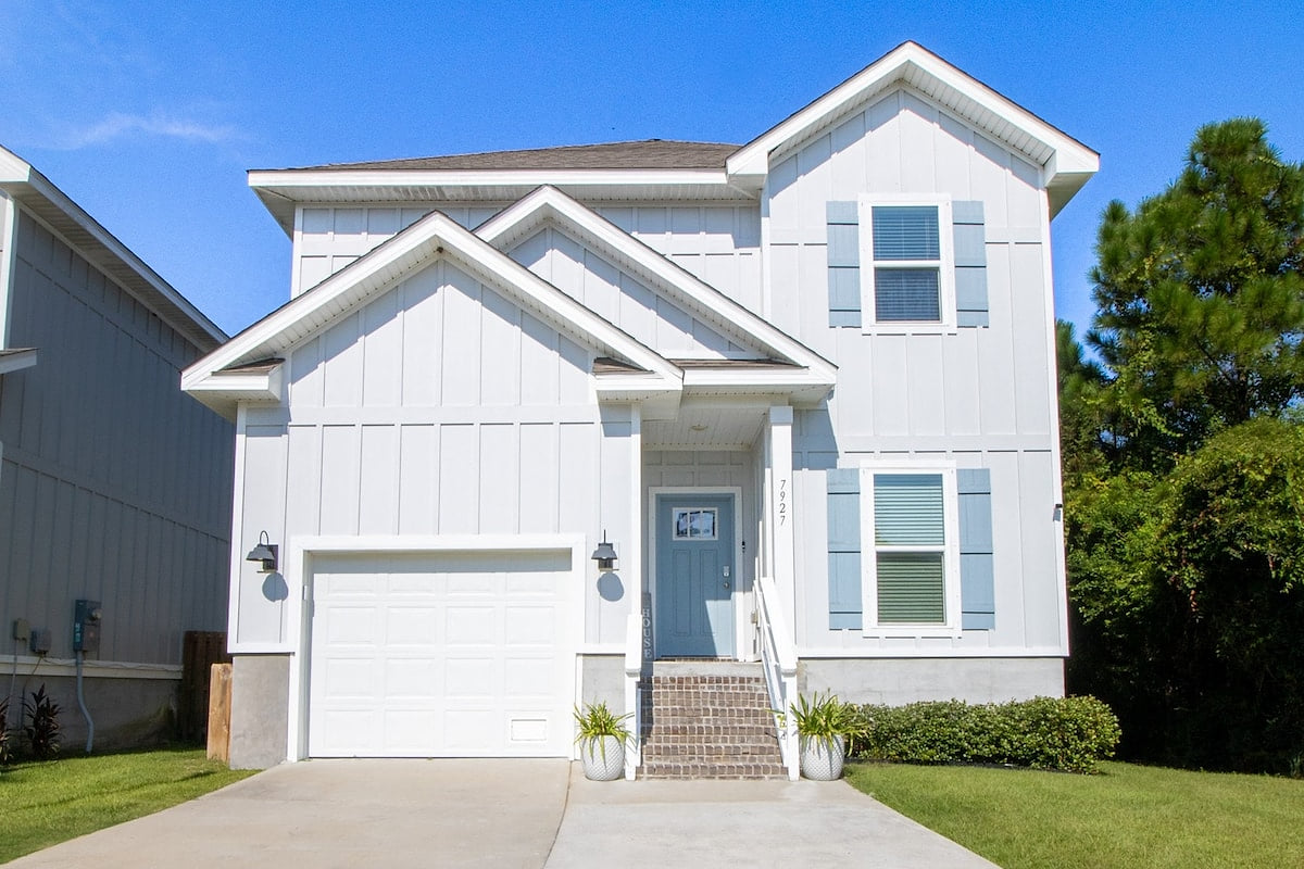 Modern coastal-style home with garage, wide drive, and welcoming entry Modern Luxury 4BR in Perdido Key - Walk to Beach