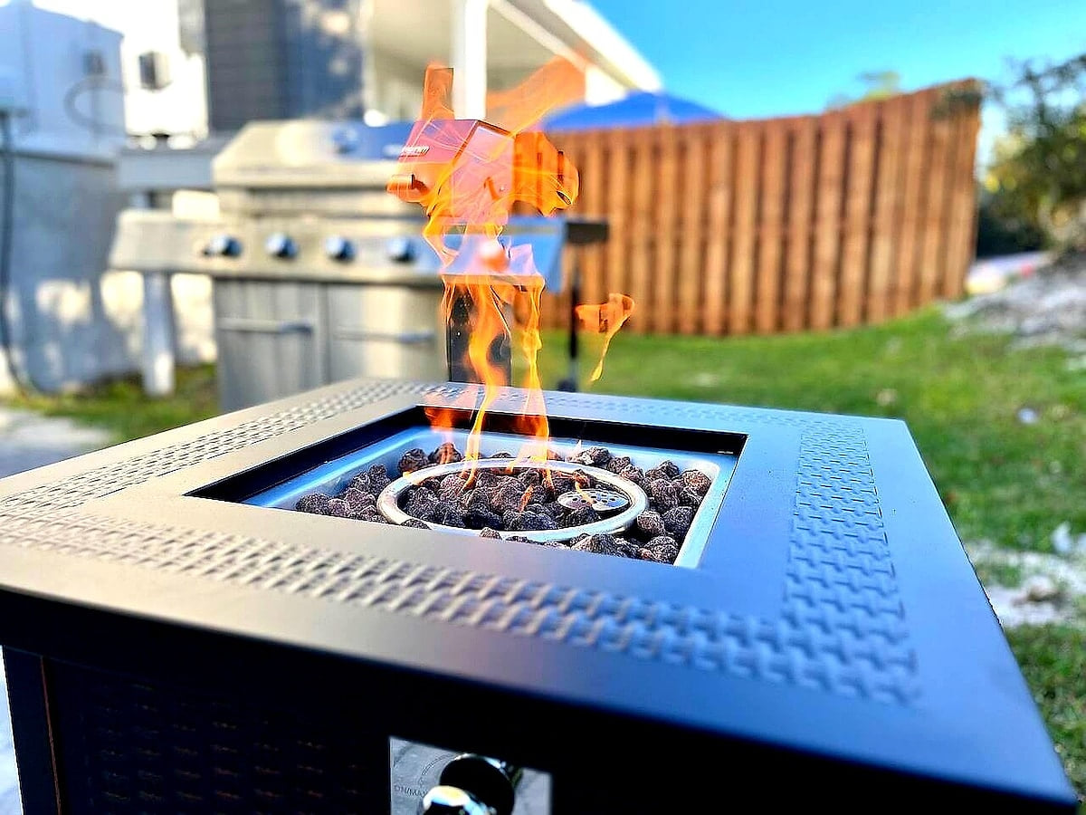 Cozy gas fire pit and BBQ grill in a private, fenced backyard oasis Modern Luxury 4BR in Perdido Key - Walk to Beach