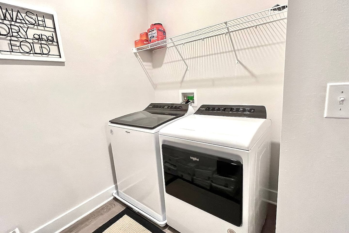 In-home laundry: new Whirlpool washer/dryer + storage shelf