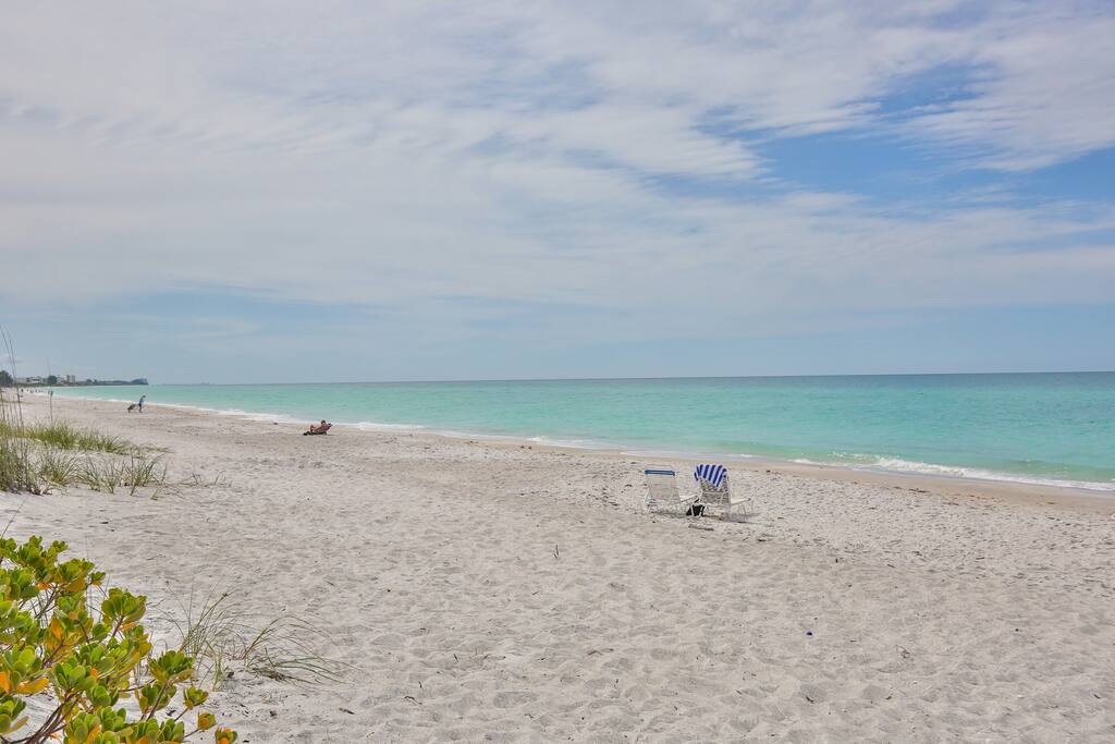 Stroll north or south on the beach or just sit and wait for the sunrise or sunset -- you've got time. - Tropical Beach Condo! - Longboat Key