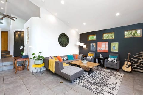 The expansive living room is the perfect place for friends and family to enjoy each other’s company in both style and comfort. Make a little music on the black-lacquered piano and Fender guitar!