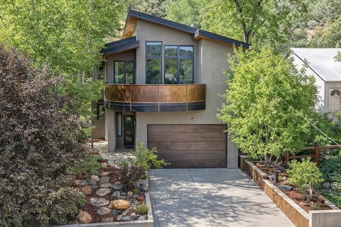 Towering Aspen trees greet you as you ascend the winding steps to the entryway of this wondrous home, featuring a keyless, self check-in Smart Lock, with entry path lighting.