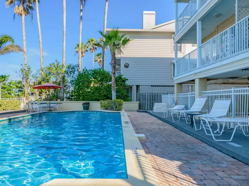 Beachside pool with Loungers, Tables, Chairs, & Grill.  Beach Access from Pool
