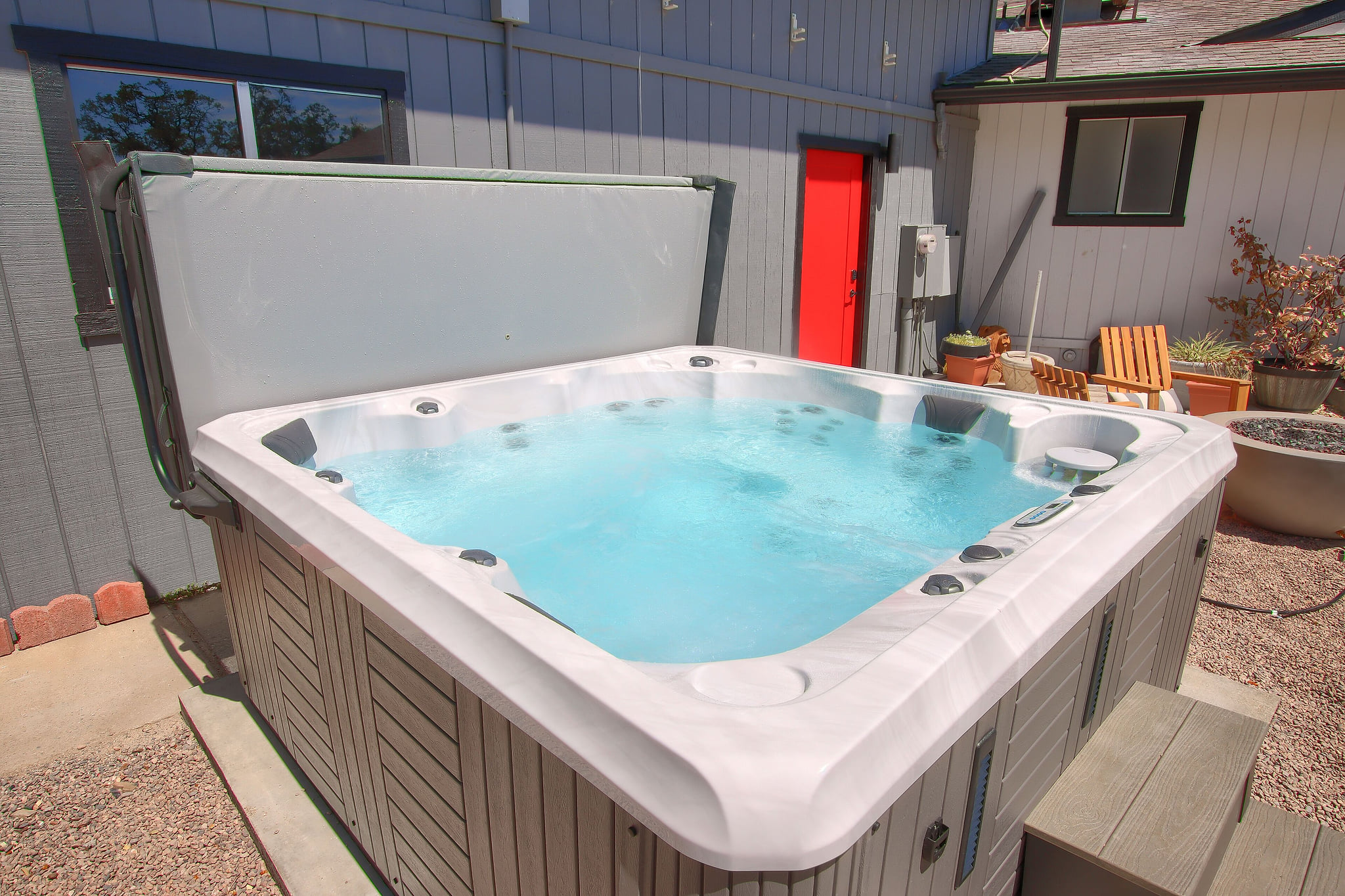 Soak in our new hot tub. Enjoy even during the day with our motorized awning BOM sleeps 22 | GameRM | Badger Pass | karaoke!