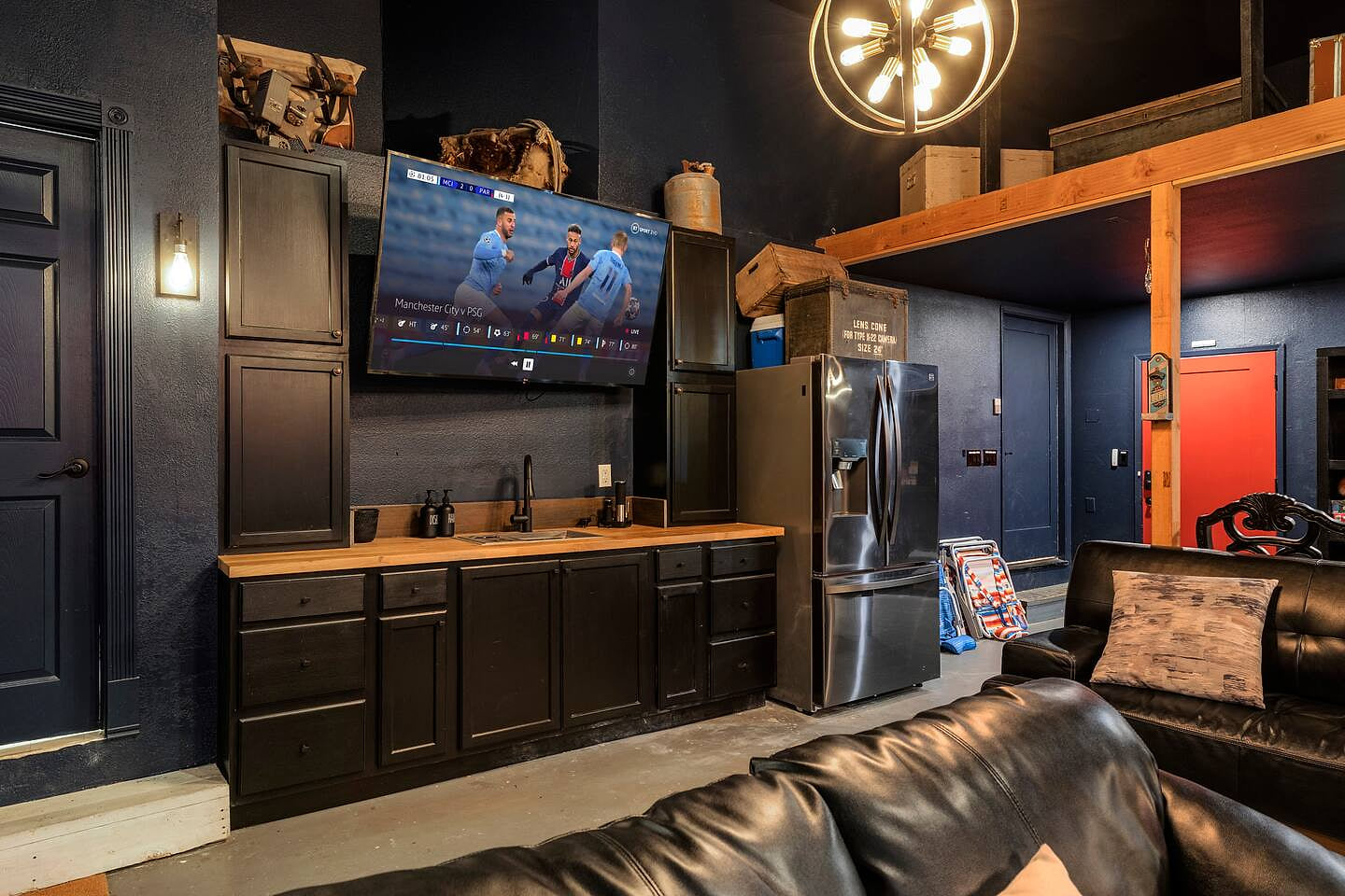 Full Refrigerator and Sink in Game Room next to Full Bath