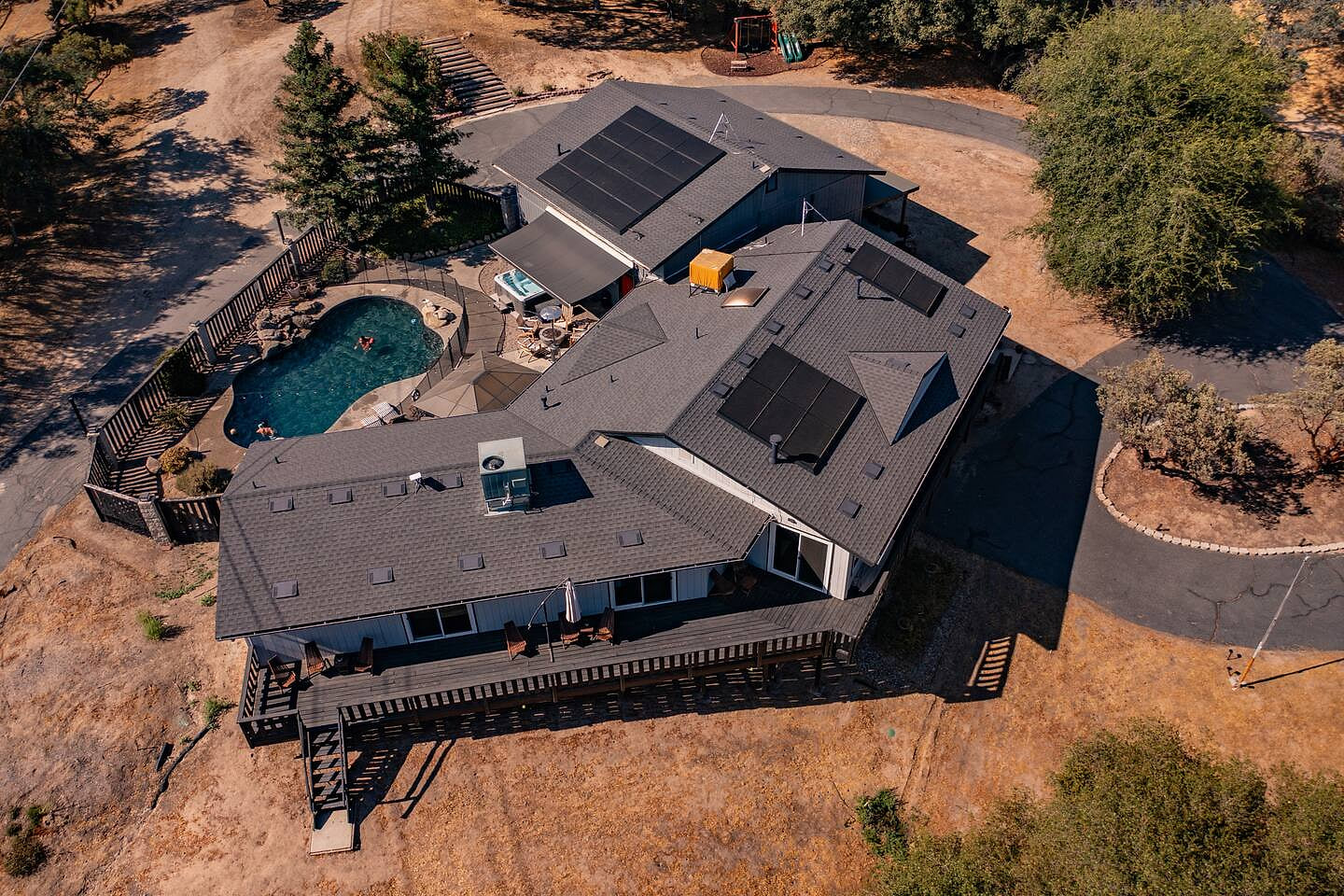 Aerial view of Black Oak Manor
Book your Summer Getaway!  Sleeps 22
Full Bathroom downstairs renovated and an additional Full Bathroom with makeup table added in June 2024
 BOM sleeps 22 | GameRM | Badger Pass | karaoke!