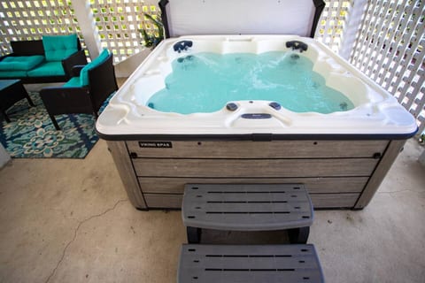 Unwind in the private hot tub after a long beach day—secluded and under cover