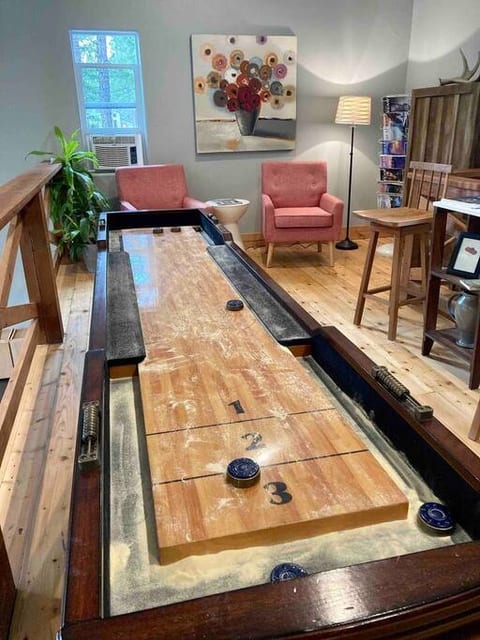Shuffleboard and loft sitting area.  So fun!