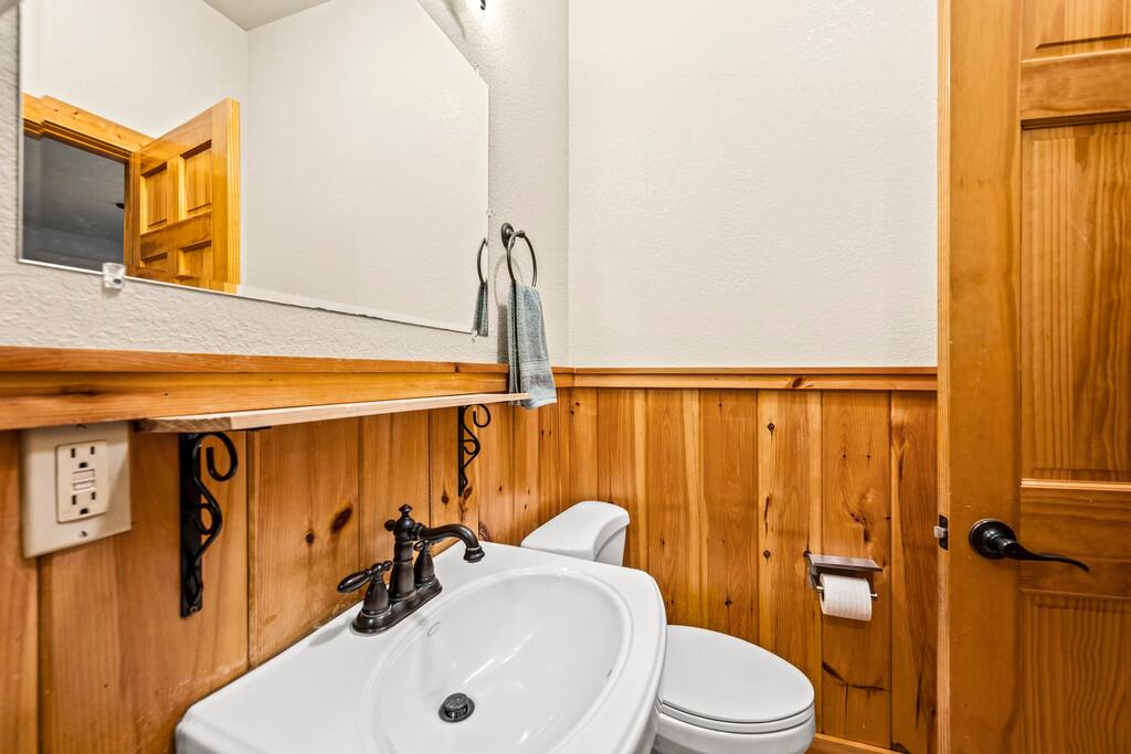 Full bathroom located off game room with shower.