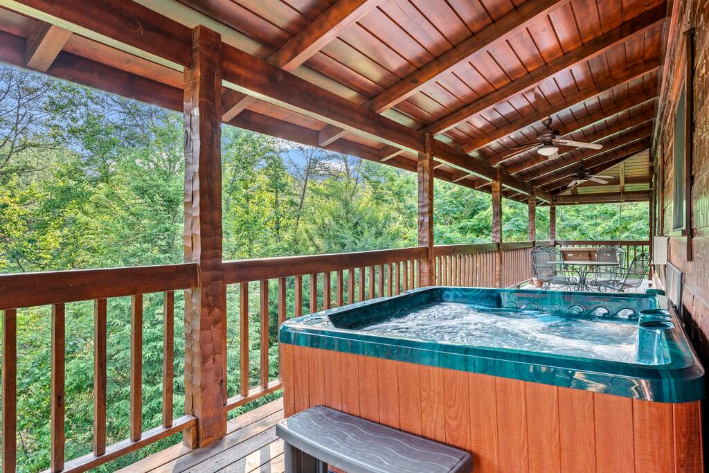 Take a dip after a long day in our hot tub with a wooded view!