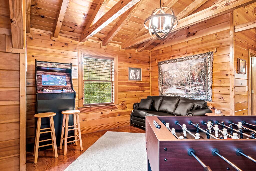 Upgraded loft now features an 14,000 game arcade, foosball and pull out sofa.