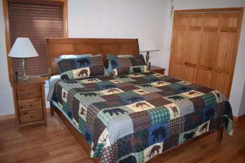 MASTER BEDROOM
King sleep number bed w/ remotes, ceiling fan, nightstands, closet with hangers, dresser for clothes, box fan, and 55" Smart TV.