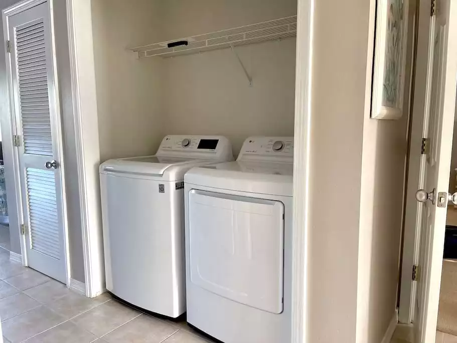 Hallway Laundry Area with full size LG Washer and Dryer Hallway Laundry Area with full size LG Washer and Dryer - Sunny Rays - A Trio of Water Wonders! - Orange Beach
