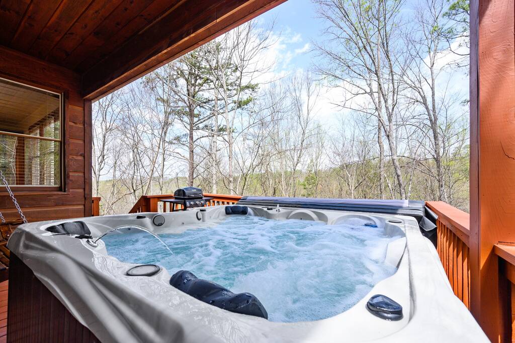 Extra Large 6 Person Hot Tub with Seasonal Mountain Ridge Line View on Partially Covered Upper Deck, Enjoy an Evening Under the Stars. Propane grill was change to a charcoal, park style grill to the left of the porch. Extra Large 6 Person Hot Tub with Seasonal Mountain Ridge Line View on Partially Covered Upper Deck, Enjoy an Evening Under the Stars. Propane grill was change to a charcoal, park style grill to the left of the porch. - Prime Location 2x King Beds PoolTable Shuffleboard - Sevierville