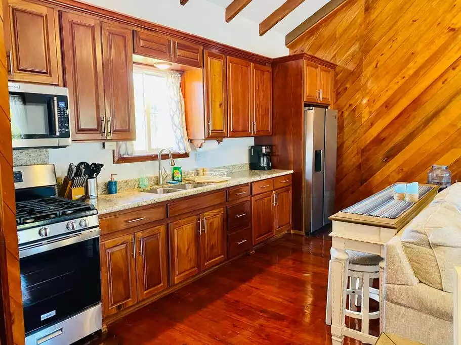 Well appointed upstairs kitchen - Coral Palms Beach House - Hopkins