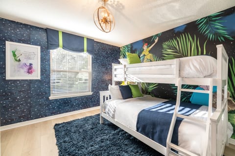 Our Peter Pan Bedroom (#6) features a twin over full bunk and whimsical Peter Pan decor.  It makes a great family suite with the connecting Jack n Jill Bathroom on the left that connects to bedroom #7 (queen).